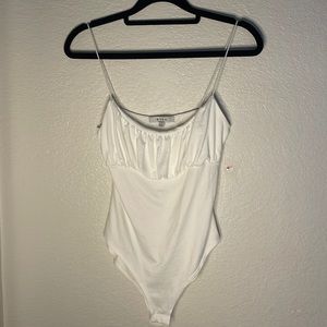 Barely worn white body suit! Brand: Gaze, size small